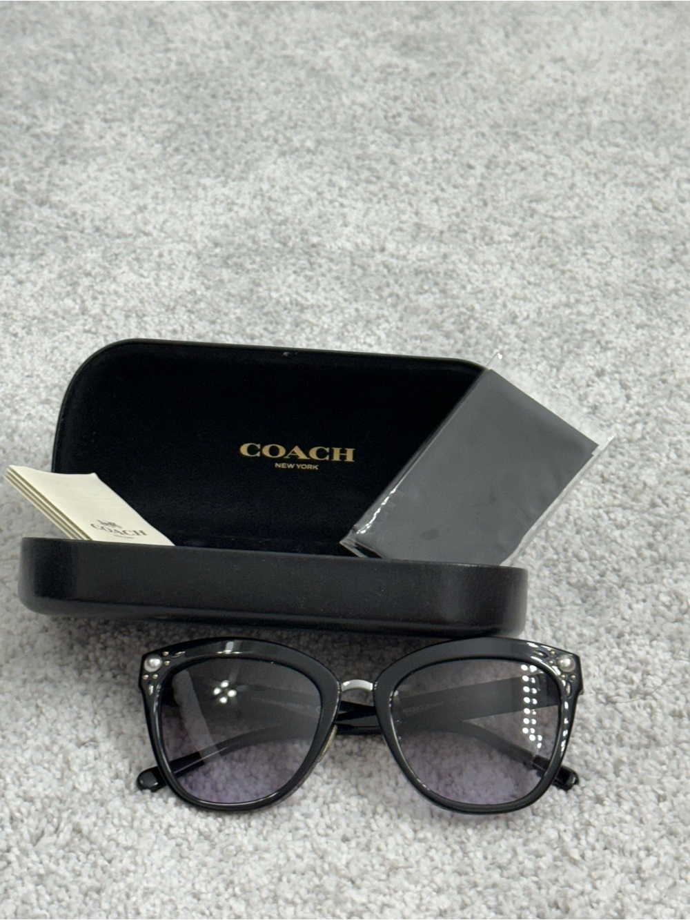 Coach Black Cat-Eye Sunglasses with Subtle Crystal Accents